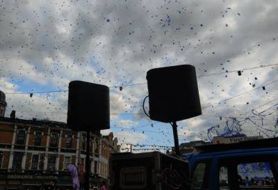 Ticker tape streams down as productions in Woolwich town square draw to a close. 2019.<br>Live sound from JEG Productions.